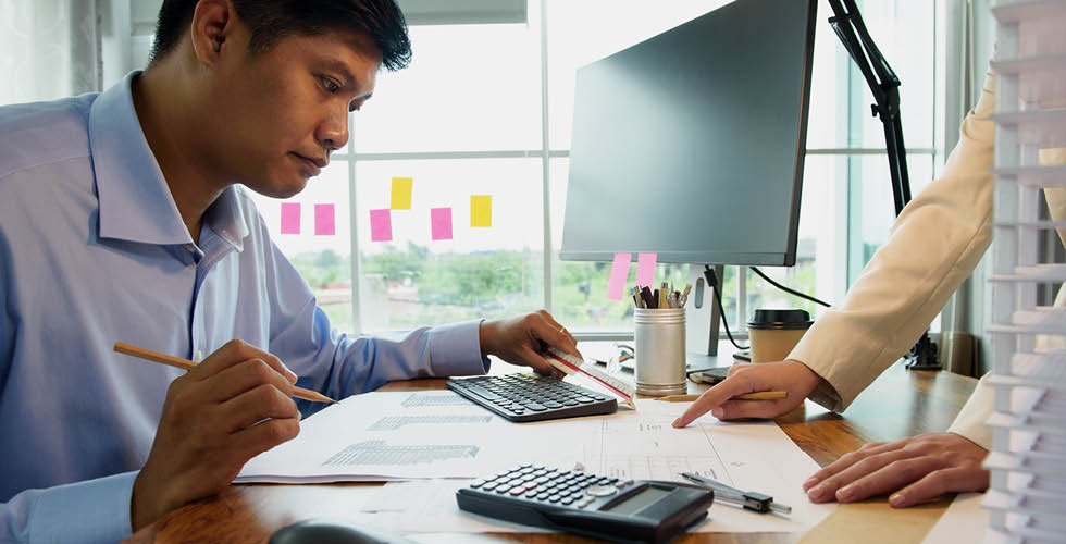 Engineers and Architect designers discuss together the interior or architecture and building structure work. Brainstorm management an idea to find a way to deal with construction.