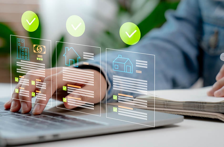 Close-up of a businessperson managing real estate data and digital property documents on laptop with checklist interface. Concept of smart property investment, mortgage approval, and digital workflow.